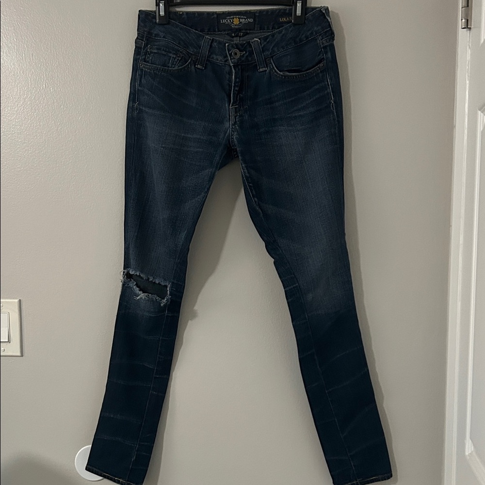 Lucky Lola Skinny dark distressed jeans.